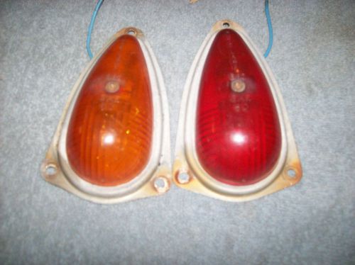 Two marker lights one red one amber both light up