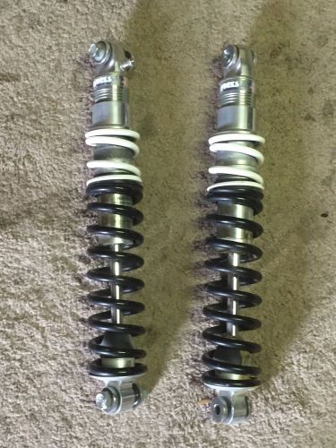 Banshee works brand front shocks with dual rate springs