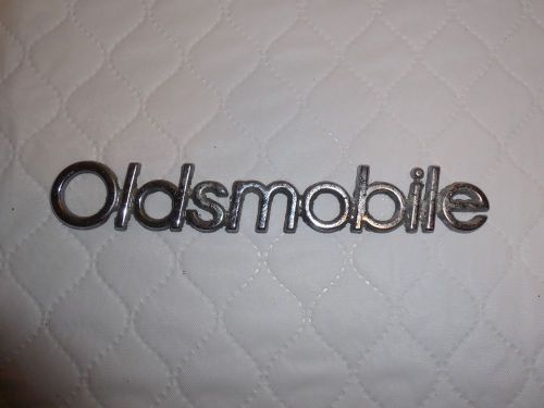 Vintage metal oldsmobile emblem