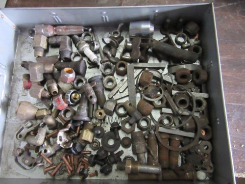 Stuff in a drawer.wheel studs,brass bits etc.drawer not included. parts lot.