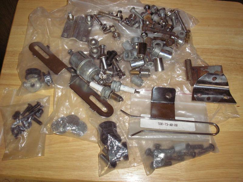 Bag of assorted motorcycle parts ,bolts ,bushings,lights,extenders,mostly yamaha