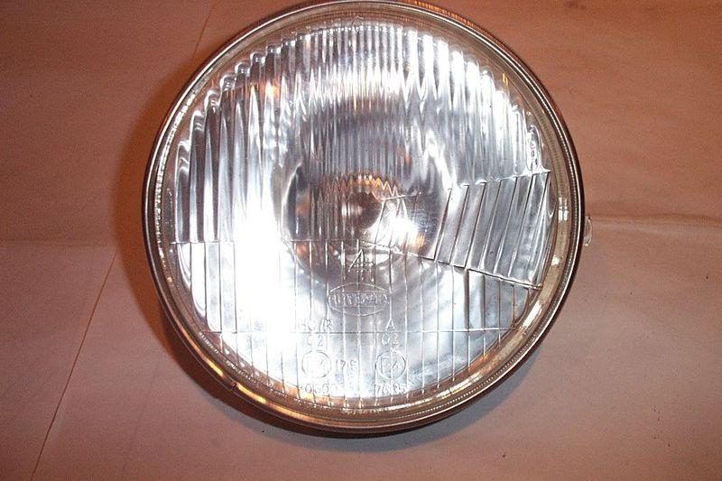 Vw/bmw/porsche (h4) 7" headlight w/housing bulb and ring great condition!