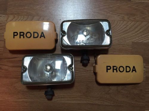 (2) vintage proda fog driving lights with covers - toyota land cruiser