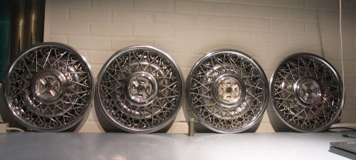 1987-92 cadillac fleetwood brougham 15&#034; complete hubcap set with gr lock nuts