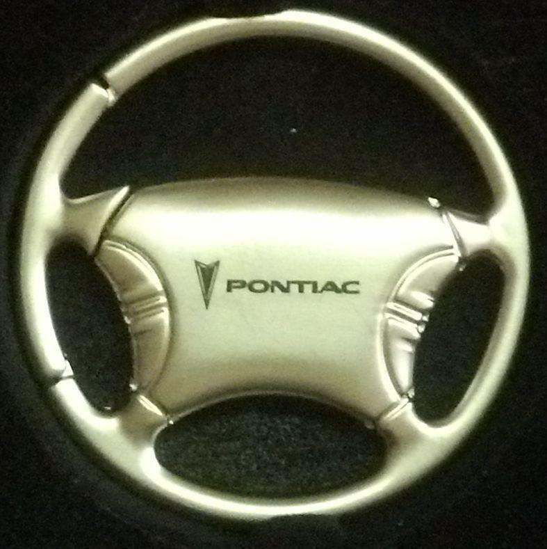 Pontiac steering wheel keychain with pontiac and symbol etched into the metal