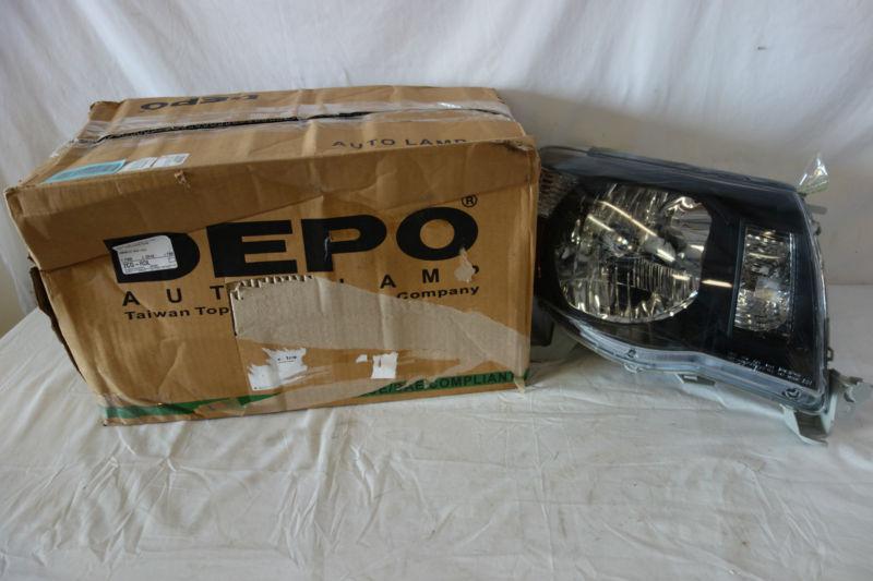 Depo toyota tacoma 05-09 headlight black bezel new depo passanger side