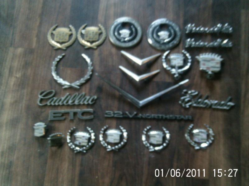 Large lot of 26 misc. cadillac emblems chrome and gold