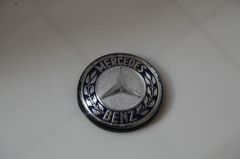 Mercedes benz blue and silver sign.  