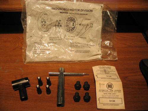 Nos oldsmobile hubcap hardware set w/ 4 security bolts, locking wrench, retainer