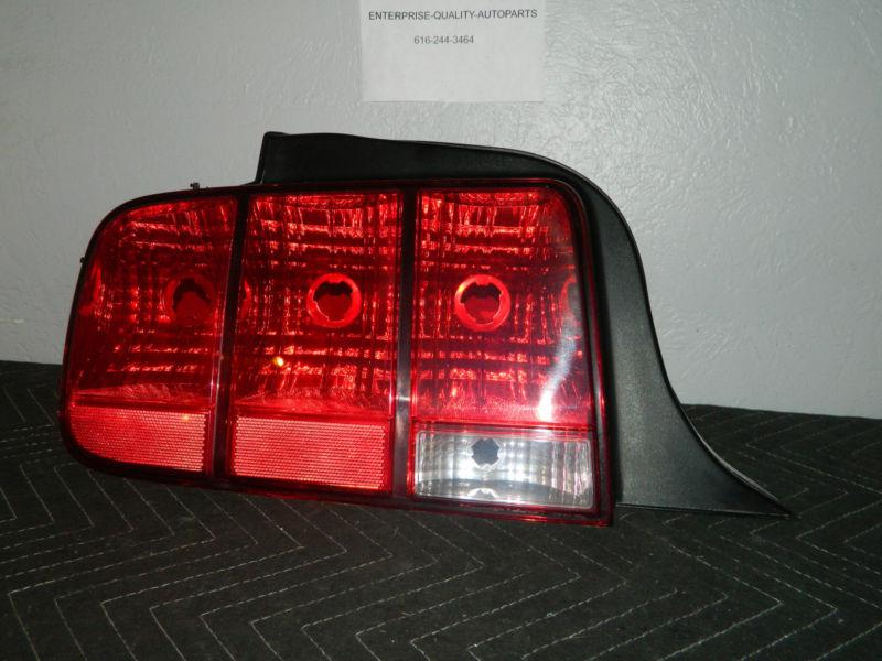 Oem 1999-2004 ford mustang left /  driver side tail light assembly 