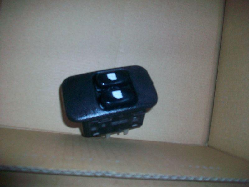 95 96 97 98 99 chevy monte carlo main power window switch bezel -good clips