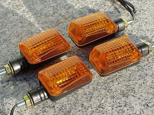 Set of four black/amber motorcycle turn signals