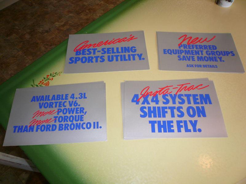 Ford showroom signs - four different signs