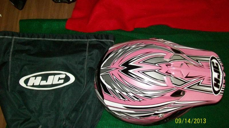 Hjc helmet in size youth large.  colors mainly pink with black, silver and white