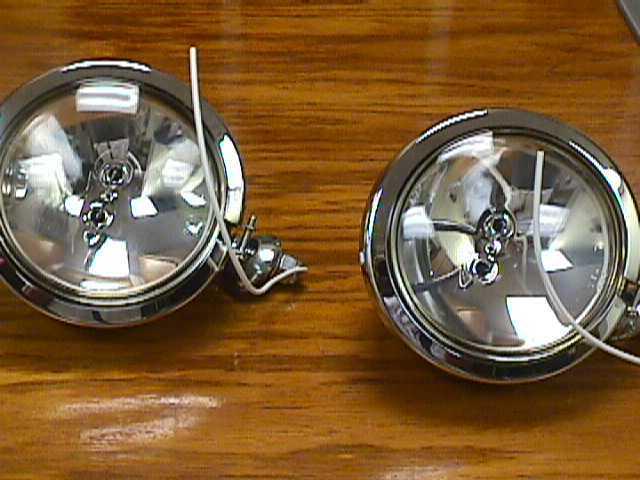 Two (2) one pair of complete clear spot lights - bulbs & housings with mounts