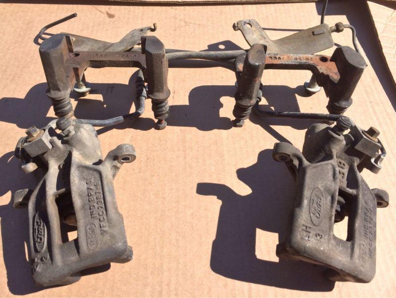 1999-2004 mustang gt rear brake calipers and brackets oem right and left 00 01