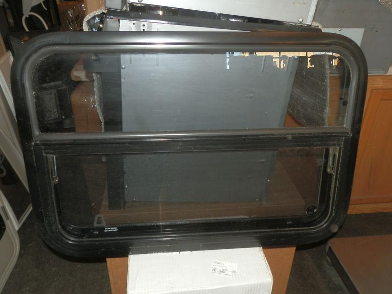 Rv black tinted crank open window r.o. 30" x 20" 