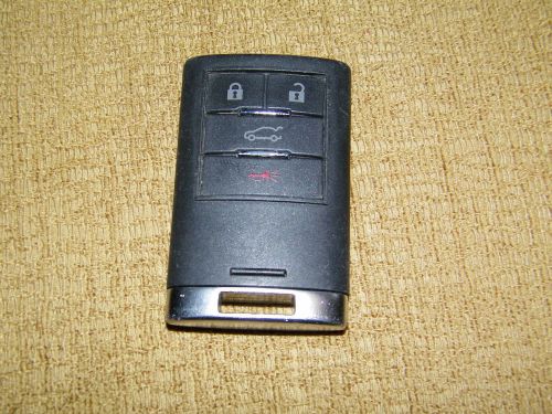 Preowned 4 button cadillac smart key fob keyless entry 22856929 009768 hella oem