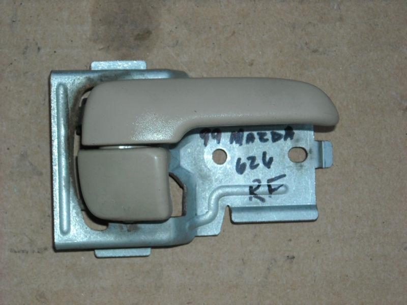 99 mazda 626 lx inside door handle r/f