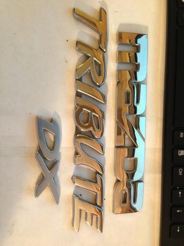 Mazda tribute rear gate emblem set used