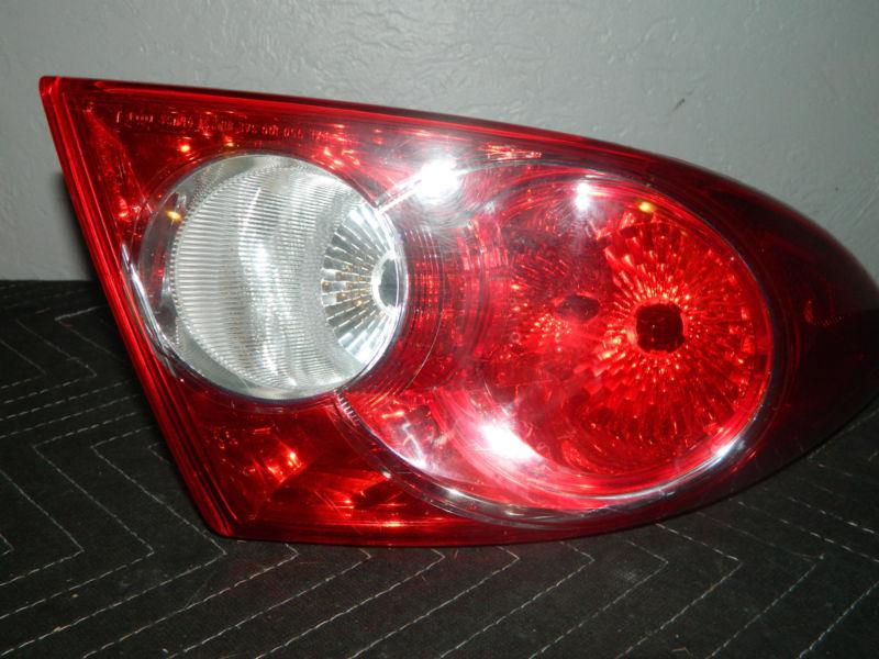 Used oem 2003-2005 mazda 6  right / passenger side tail light assembly