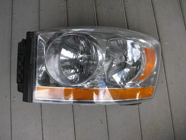 Drivers headlight headlamp assembly  "oem"  06 dodge truck