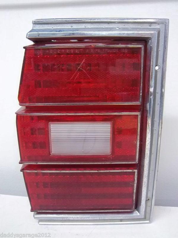 77 - 79 chevy wagon. oem, lh tail light with bezel and sockets