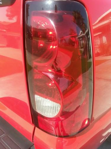  2004-2006 chevy silverado  right side tail light lens used oem part .