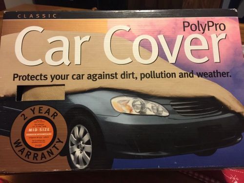 New in box polypro car cover for mid size cars