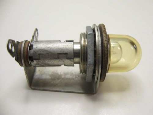 Vintage dialight pilot light indicator with yellowish dome lens tube amplifier