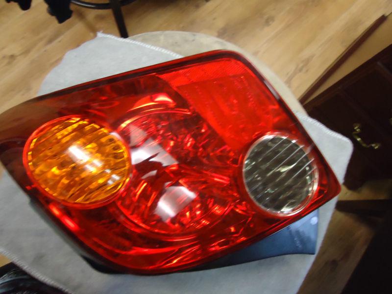 Scion xa 2004-2005, passenger side tail light lens and housing 