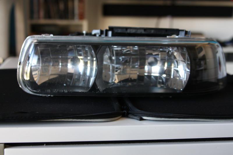 Used - aftermarket front left headlight chevy/surb/tahoe/silverado 1500 99-02