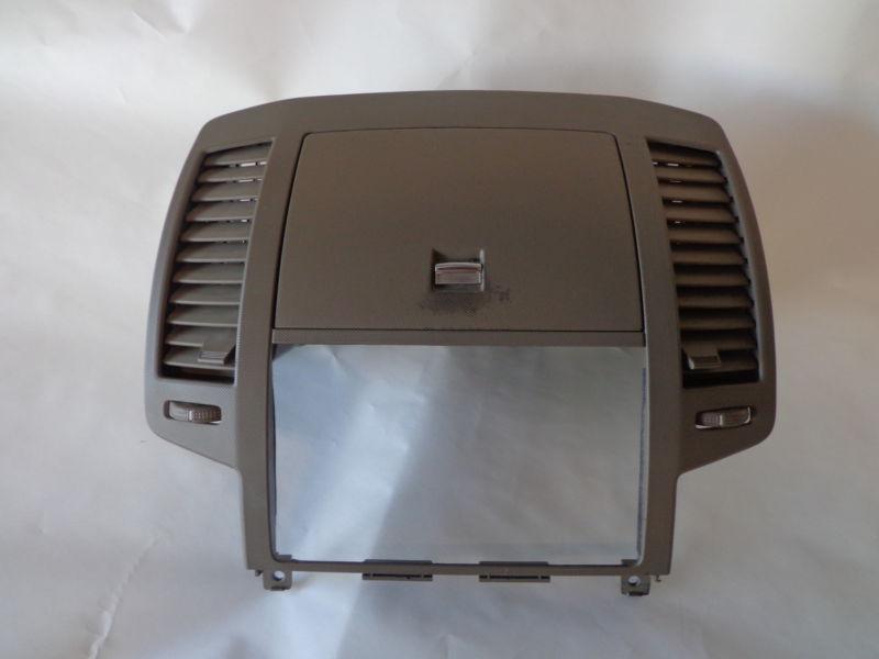 05-06 nissan altima center dash radio bezel w/ vents and compartment tan