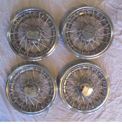 4 chrome wire-wheel covers with anti-theft retaining bracketts, good condition