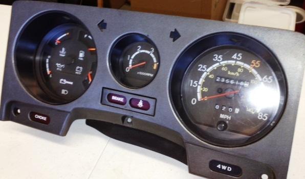 1985 land cruiser fj60  bezel (cover plate) for the fuel, tach and speedometer 