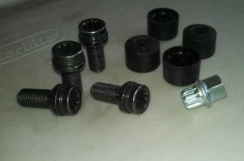 Vw & audi wheel lock set with caps oem new