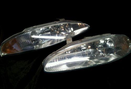 1995-1998 mitsubishi eclipse drivers and passenger side headlights--oem