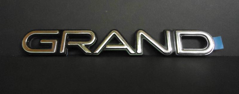 New gm "grand" prix emblem fits l /r fr door/rear 1990-1996 #10254122 1025-4122