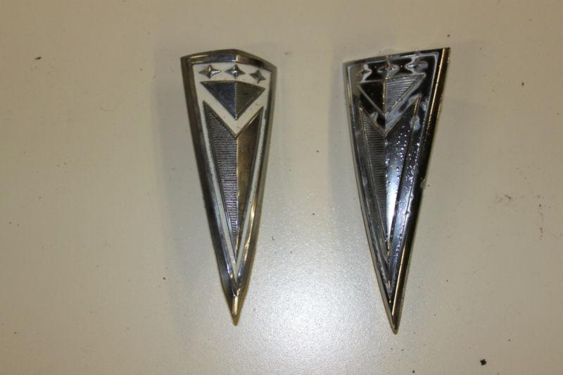 1962 pontiac grille center/trunk arrowhead enblems  oem!!