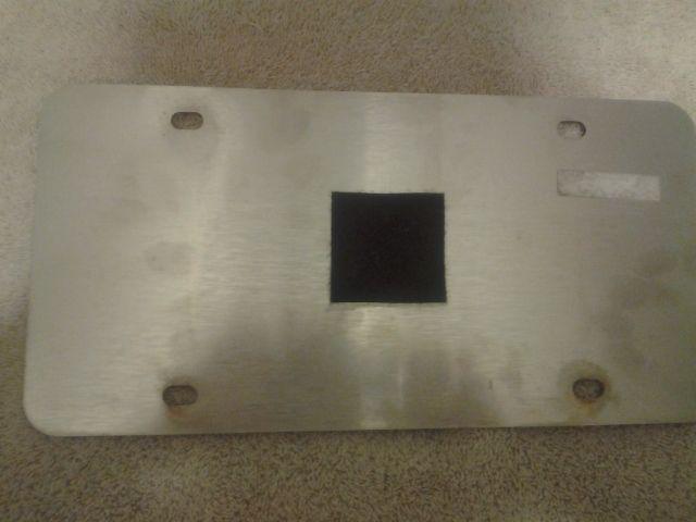 Used genuine oem mercedes benz polished stainless steel front license plate 