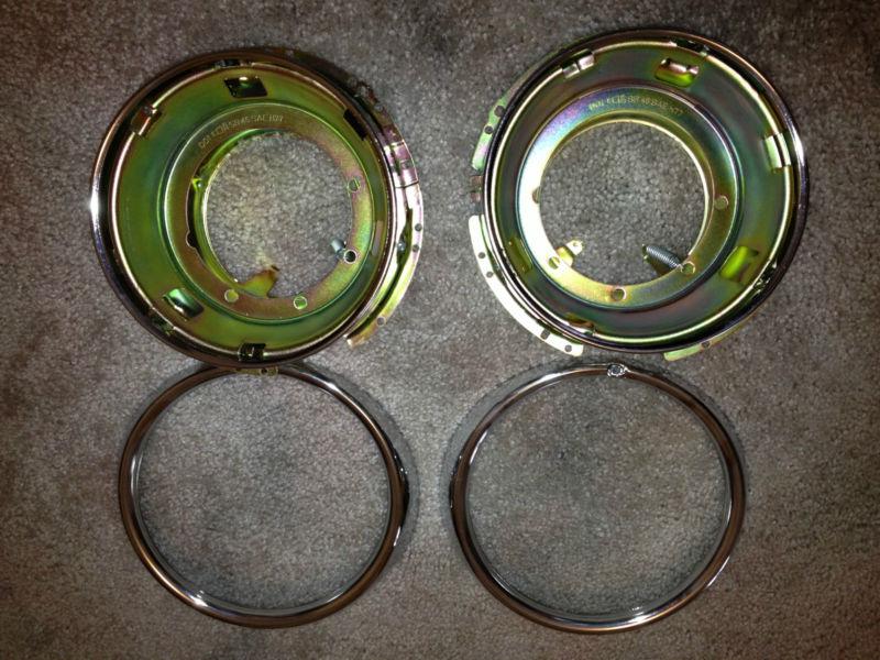 1967-77 volkswagen beetle pair of headlight buckets and bezels