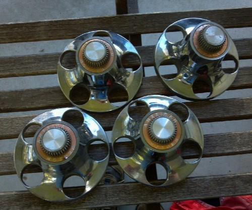 Classic original amc chrome center hubs. rally style.