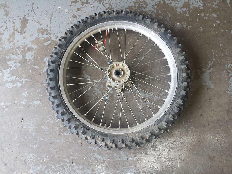 1999 yamaha yz400f yzf400 front wheel with weather cracked tire. oem w/ bushings