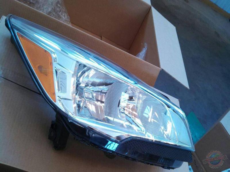 Headlight  escape 1218268 13 new oem surplus  no bulbs  note