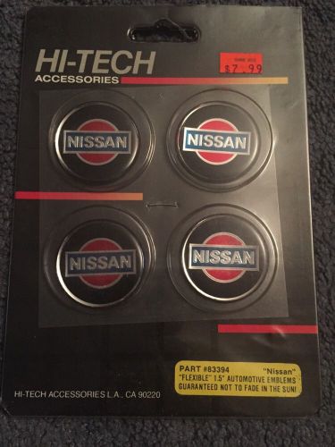 1982 nissan wheel medallions. new.