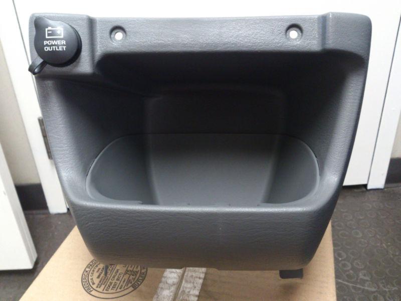 Front console lower storage bin and power outlet, great condition, new-open box.