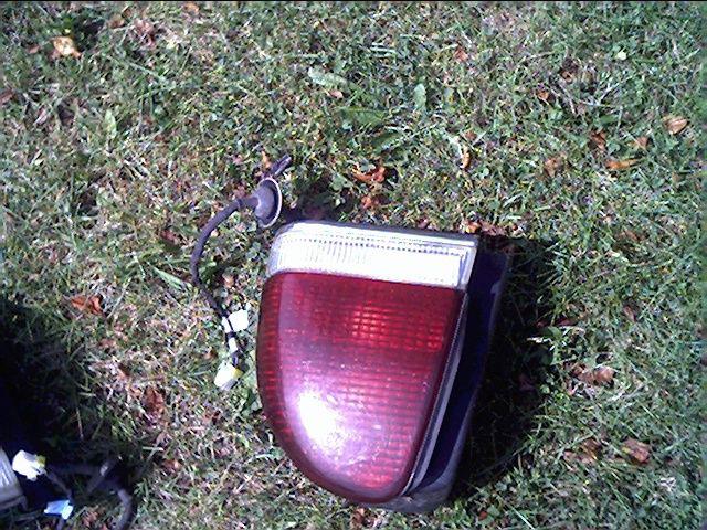 Used lh s driver's right tail light 94-97 chrysler complete w/con wire & bulbs