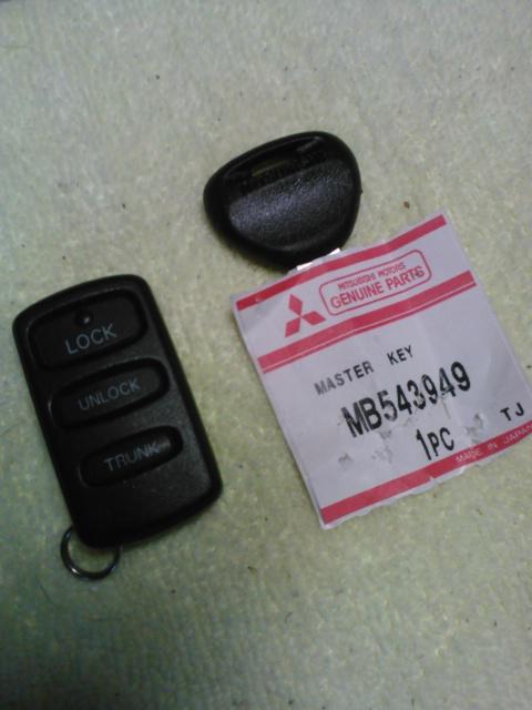 Used mitsubishi remote keyless entry fob with new master key blank (bonas)