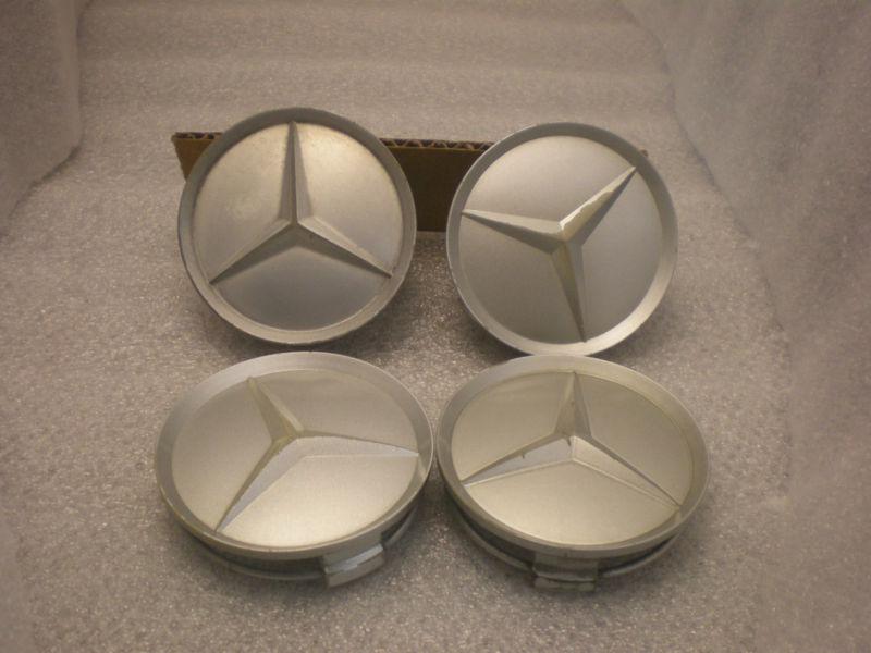 Set of 4 mercedes-benz factory oem silver center caps p/n 201 401 02 25