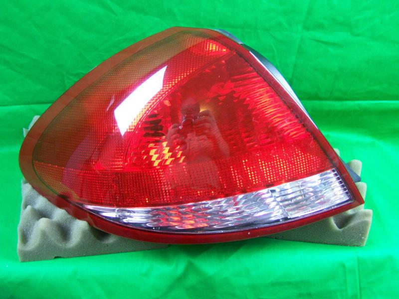 Used oem 2007 ford taurus left side taillight / drivers 